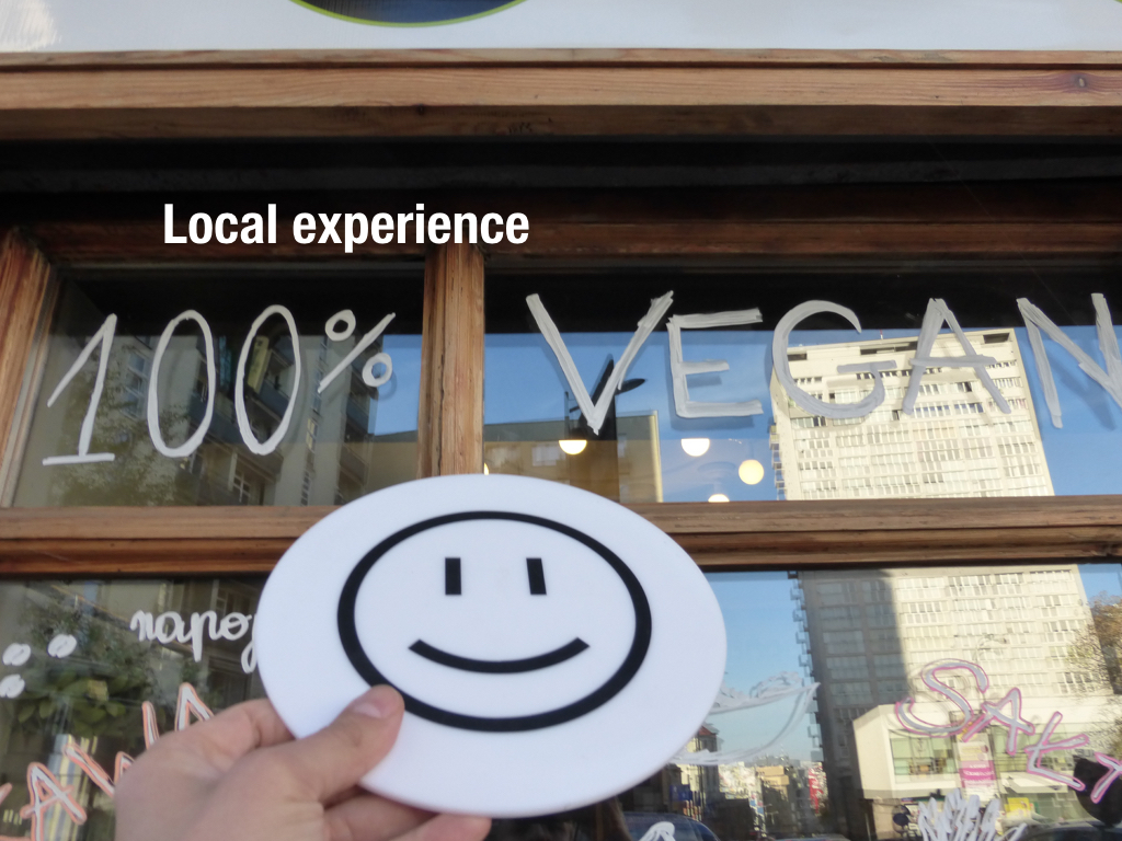 tourist experience - positive emoticon at the vegan restaurant